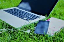 Case Studies for Climate Finance in Asset Recycling, laptop on green grassy patch
