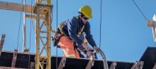 Institutional Responsibilities: Review and Approval, construction worker fixing harness of structure beam