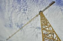 Implementing Principles, crane perspective, towering over sky backdrop, structure