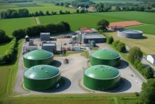 Biodigesters Deployment Model for ERP, large green tank with a green lid sits in front of a field