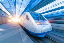 Photo railroad travel passenger train with motion blur effect, concept tourism.